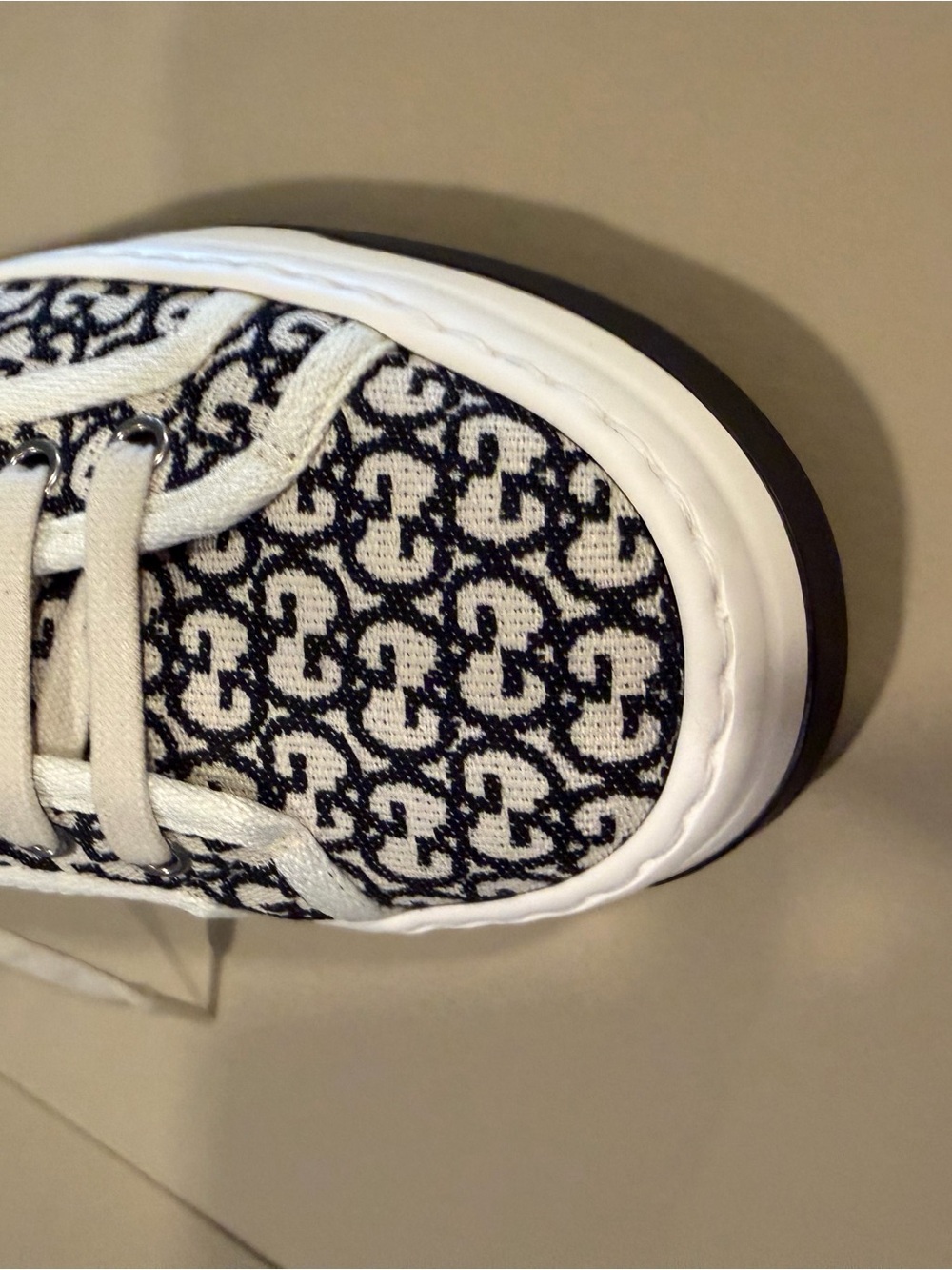 Gucci GG Canvas Low-Top Sneakers in Black & White - Picture 6 of 7